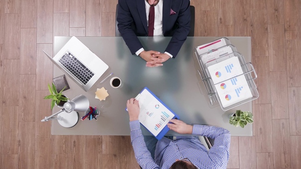top-view-businessman-analyzing-financial-documents-discussing-company-strategy-jpg